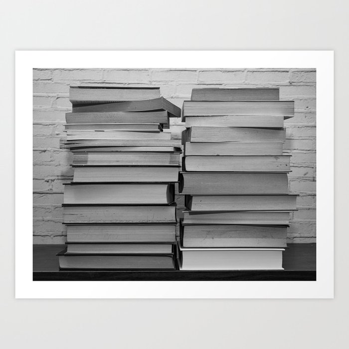 Black and white image of some books stacked on a shelf Art Print