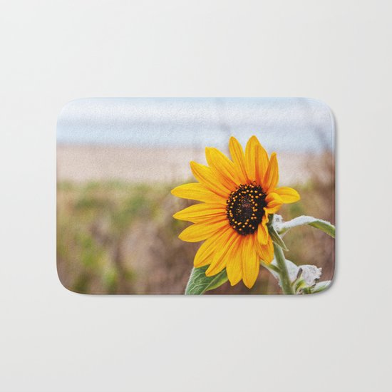 Sunflower near ocean Bath Mat