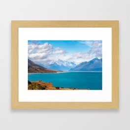 Blue waters of Lake Pukaki with snow-capped Mount Cook in the background in New Zealand Framed Art Print