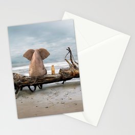 elephant and a dog are sitting on driftwood Stationery Card
