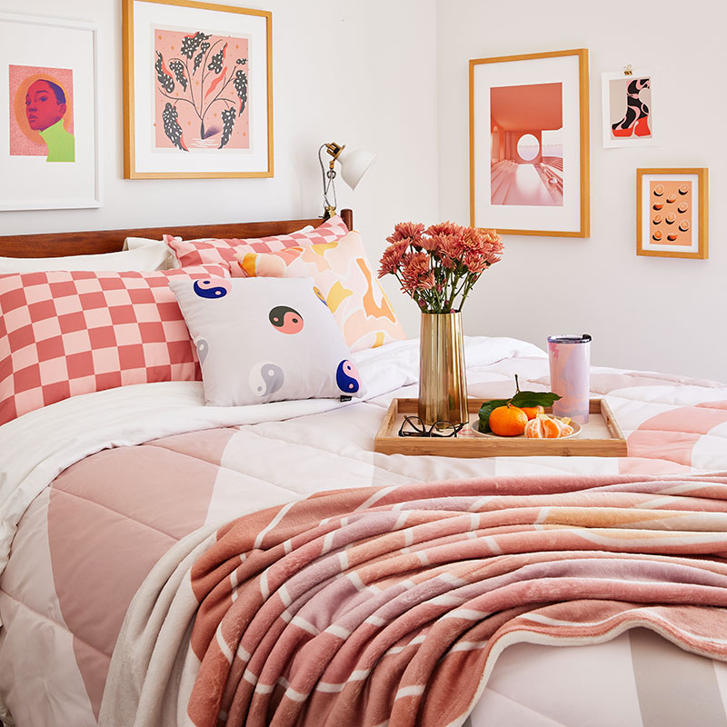 pink and beige gradient patterned comforter