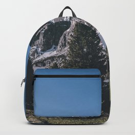 Snowy mountain range view in nature Backpack