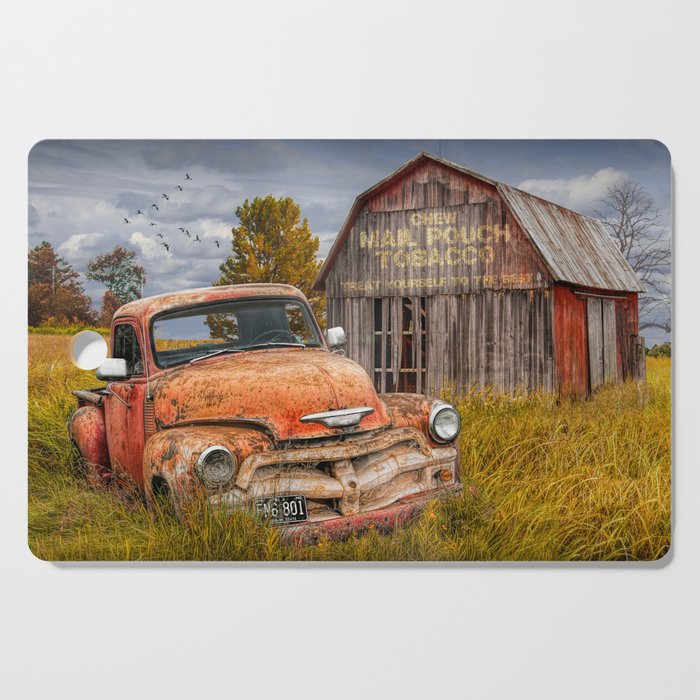 Rusted Pickup Truck in a Rural Landscape by Old Weathered Barn in Michigan Cutting Board