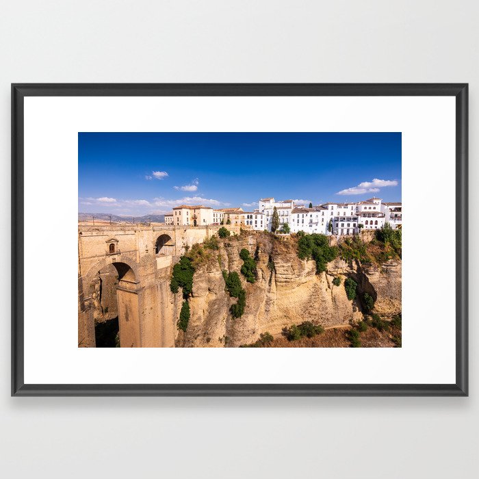 Puente Nuevo stone bridge and Pueblos Blancos in mountaintop town of Ronda in Spain Framed Art Print