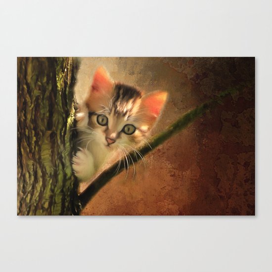 Little cute kitten on a tree Canvas Print