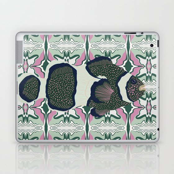 Clownfish swimming on a green and pink patterned background Laptop & iPad Skin