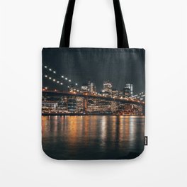 Brooklyn Bridge and Manhattan skyline at night in New York City Tote Bag