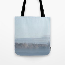 Dutch winter landscape with mist above meadow and trees Tote Bag