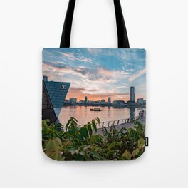 Strolling along Singapore skyscrapers near Esplanade and Marina Bay Sands Tote Bag