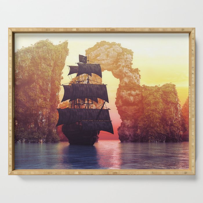 A pirate ship off an island at a sunset Serving Tray