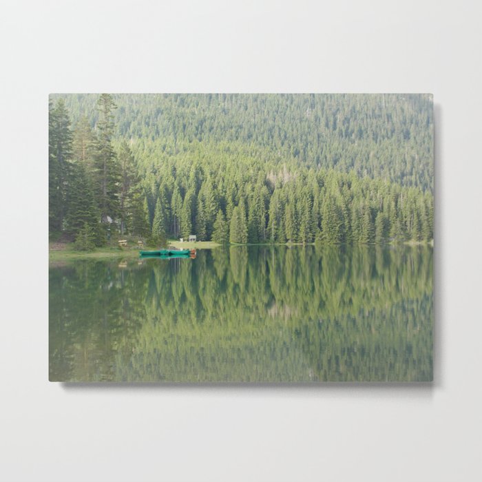 Green water reflection with a boat Metal Print