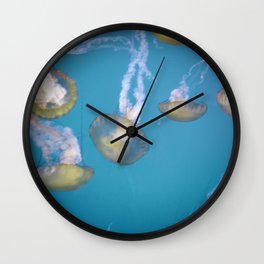 yellow jellies, blue water Wall Clock
