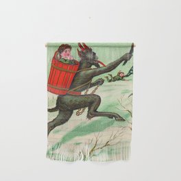 The Krampus stealing a child Wall Hanging