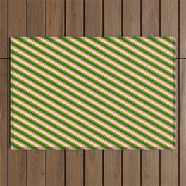 [ Thumbnail: Bisque, Dark Goldenrod, Green, and Light Coral Colored Lines Pattern Outdoor Rug ]