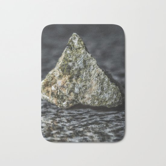 Epidote resting on granite Bath Mat