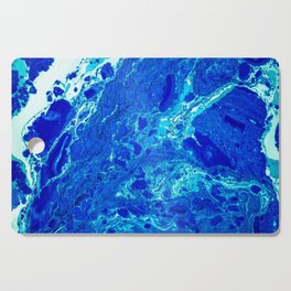 AN ABSTRACT PATTERN IN THE BLUE WATER SURFACE Cutting Board