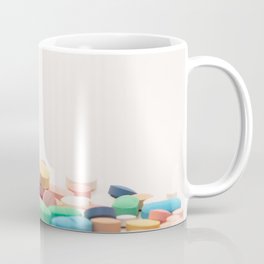 Numerous medicines Medications in the form of tablets. Colored pills on a white background. Coffee Mug