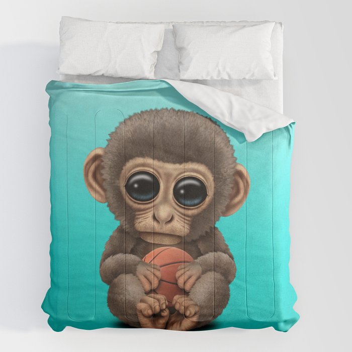 Cute Baby Monkey Playing With Basketball Comforter by Jeff Bartels