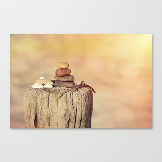 Balanced stone cairn in sunset light Canvas Print