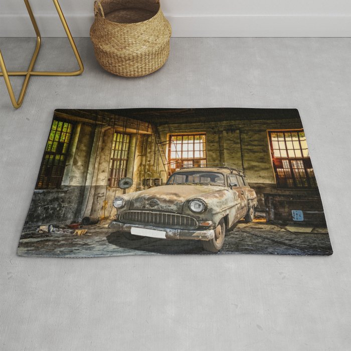 Old Car in a Garage Rug by moonfluff