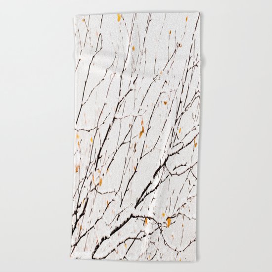 Snowy birch twigs and leaves Beach Towel