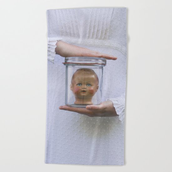 Doll in a jar Beach Towel