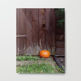 Orange pumpkin by wooden door Metal Print