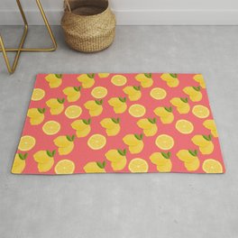 Fresh whole lemons and slices on a raspberry background Area & Throw Rug