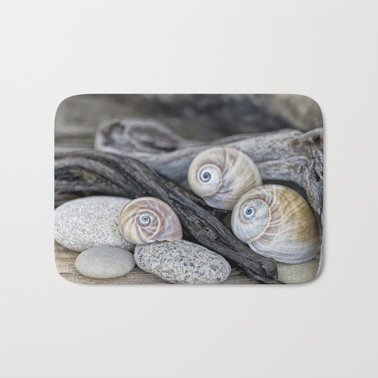 Shark's eye shells and driftwood Bath Mat