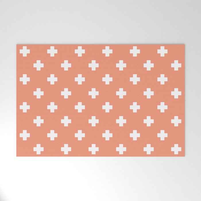 White Swiss Cross Pattern on Coral background Welcome Mat