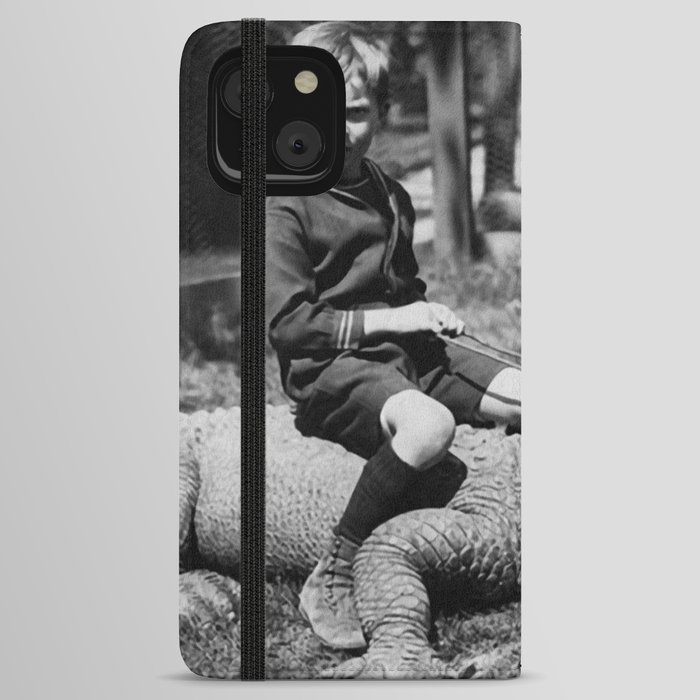 Little boy riding pet alligator strange and weird portrait black and white photograph - photography - photographs iPhone Wallet Case