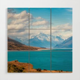 Blue waters of Lake Pukaki with snow-capped Mount Cook in the background in New Zealand Wood Wall Art
