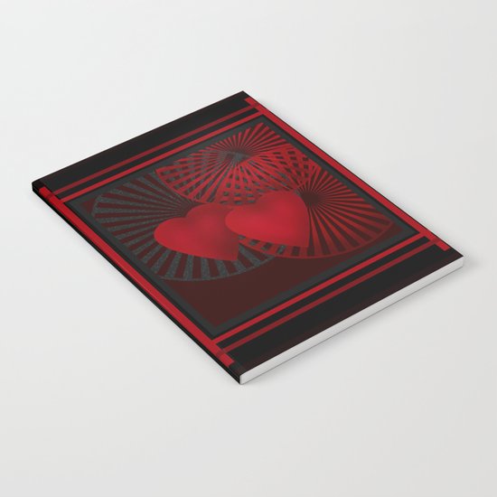 Love. The loving hearts .Black background . Notebook