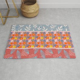 Blue, Pink, and Red Color Block Design with Flowers and Plants Rug