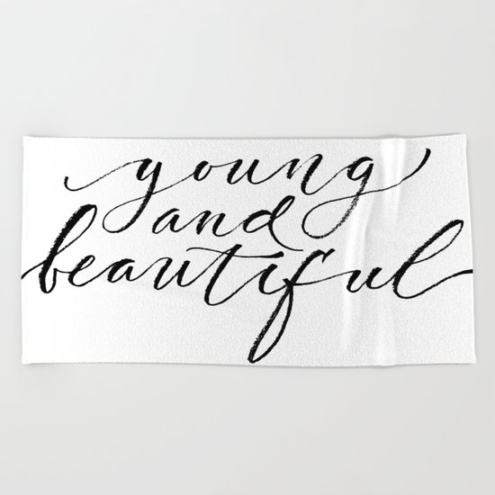 Young and beautiful Beach Towel