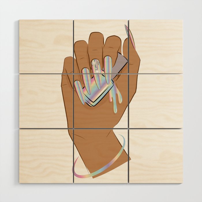 Hand with holographic long nails holds nail polish Wood Wall Art