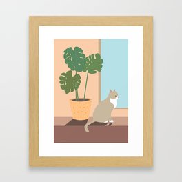 Cat and monstera plant Framed Art Print