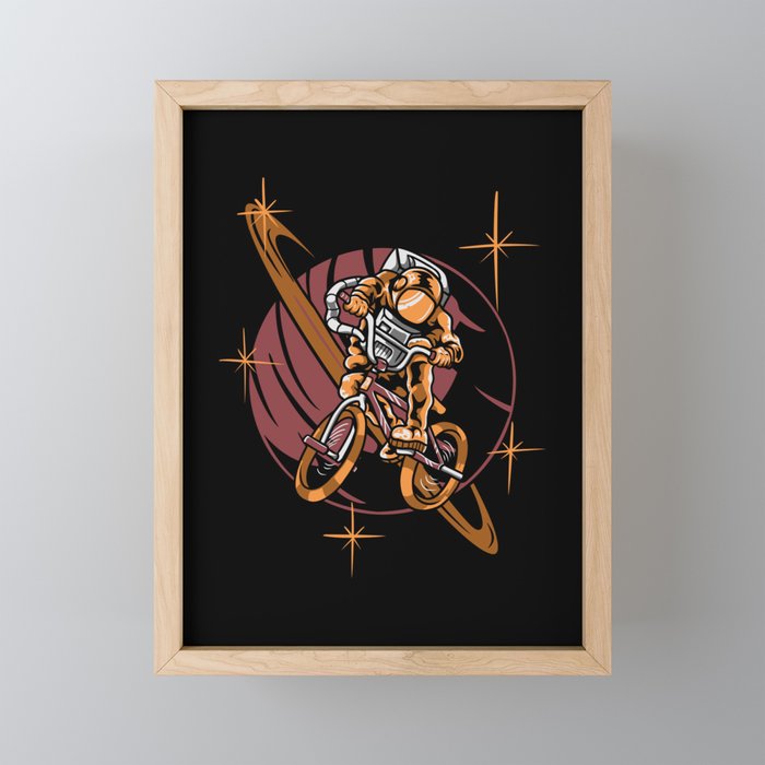 Astronaut Riding Bike Framed Mini Art Print