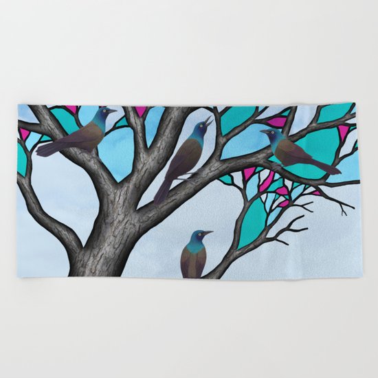 grackles in the stained glass tree Beach Towel