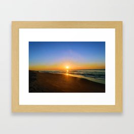 Sunrise over the beach Framed Art Print