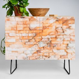 Retro style background or texture in double exposure. The stonewall from old orange bricks.  Credenza