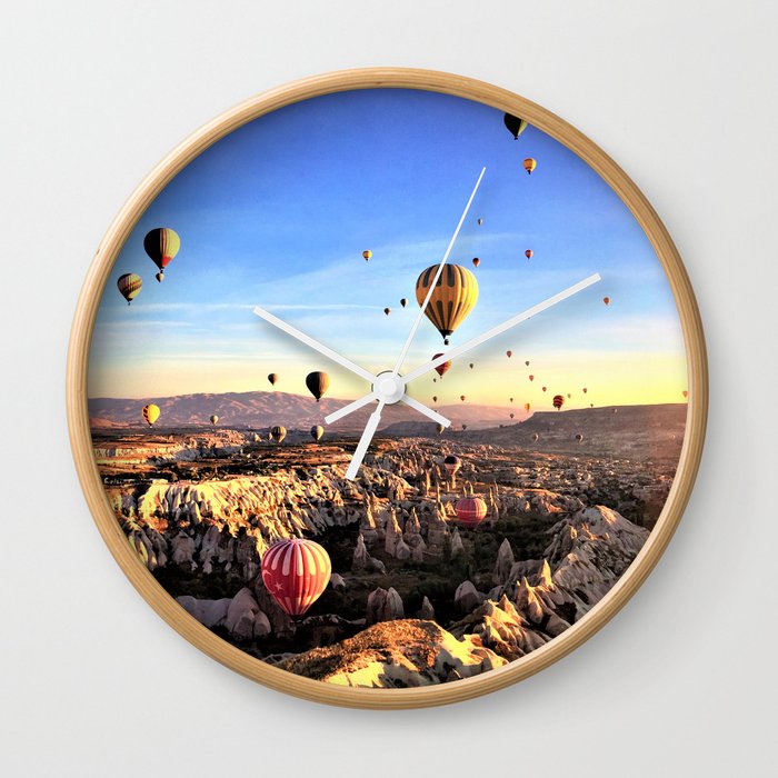 hot air balloons flying valley sky sunset Wall Clock