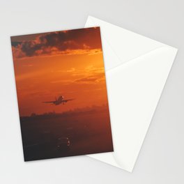 Airplane taking off from New York City airport into the sunset Stationery Card