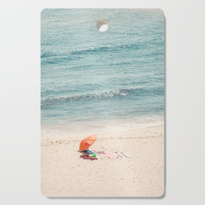 Aerial Orange Beach Umbrella - Ocean - Beach and Sea photography by Ingrid Beddoes Cutting Board