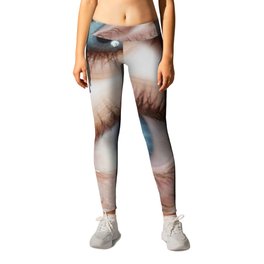 Psychedelic abstract background of distorted eye pattern with one big eye looking real eyes with blue colors splash Leggings
