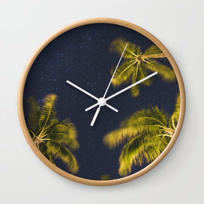 Palm trees at night against starry sky Wall Clock