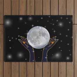 Womans hands holding the moon on a starry night Outdoor Rug