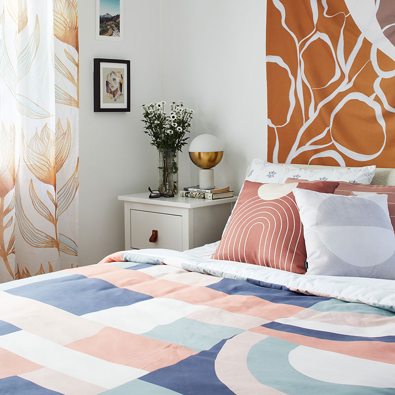 bed with neutral abstract duvet cover