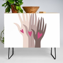 Hands of different races. Credenza