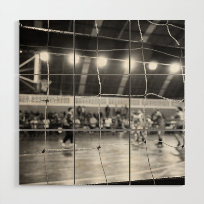 Black and White Photo of a handball game from behind the net Wood Wall Art